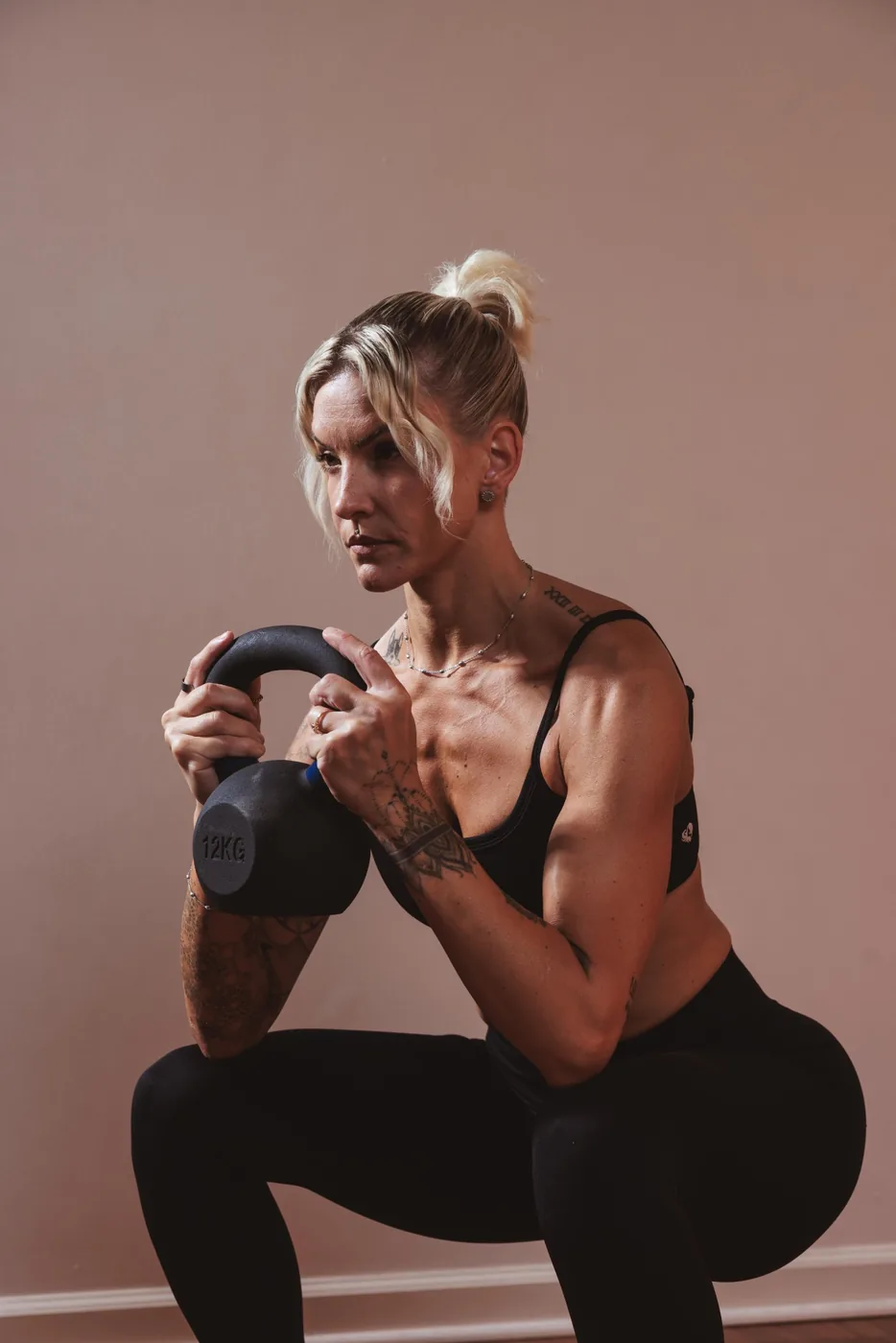 Lydie in a kettlebell squat at Sculpte Santa Barbara